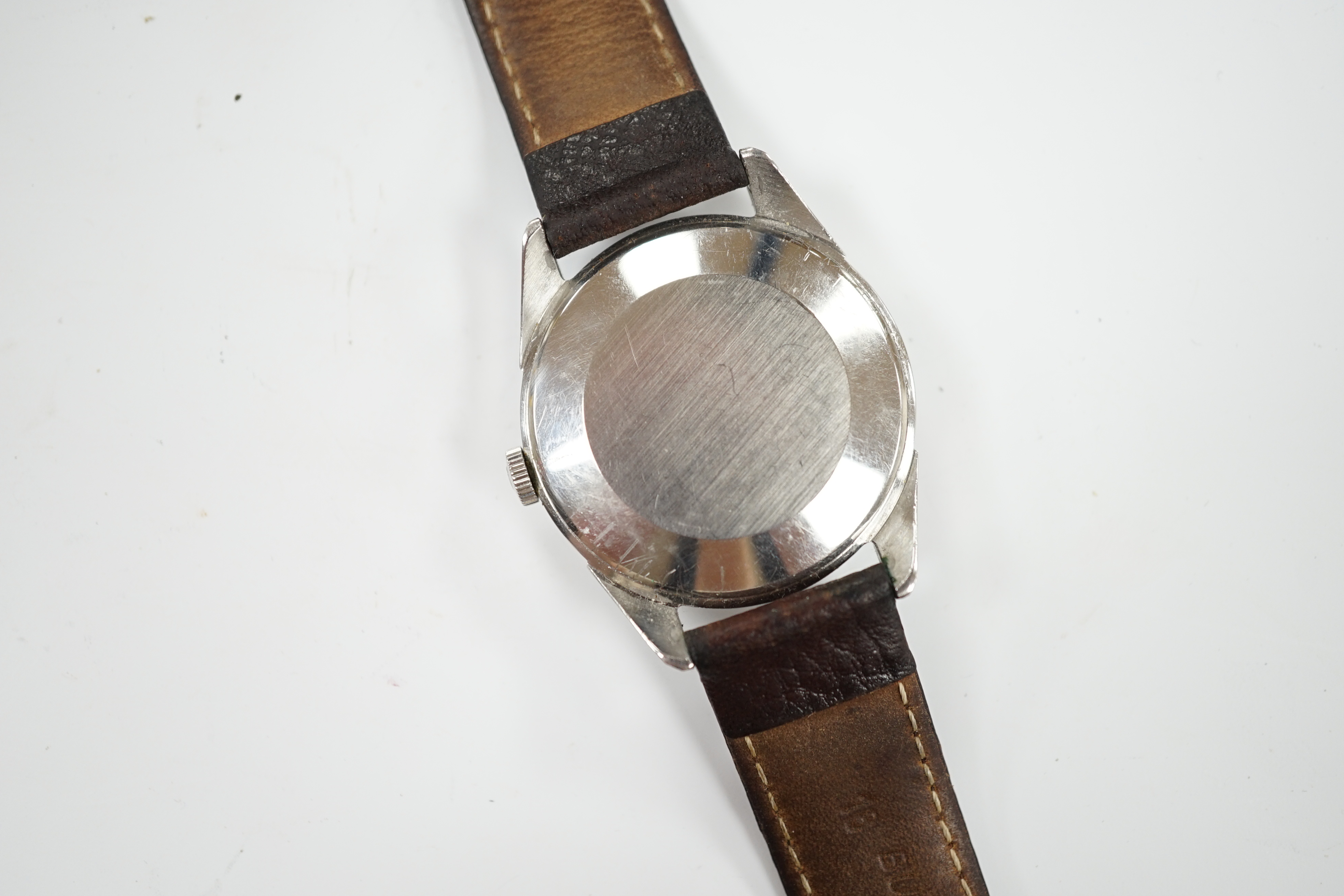 A gentleman's late 1950's stainless steel Omega manual wind wrist watch, with baton and Arabic numerals, movement c.284, on associated strap, case diameter 35mm.